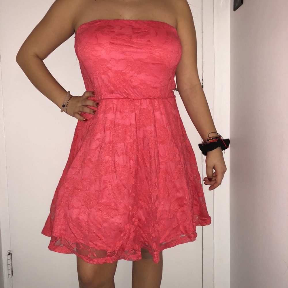 Coral strapless mini dress.